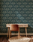 Decorative surface design in teal and blue featuring a pattern of abstract leaves painted with visible, superimposed texture