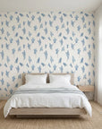 Ink Blossom serene blue floral sprig wallpaper adding character to a cozy bedroom