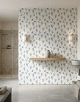 Ink Blossom serene blue floral sprig wallpaper creating ambiance in a serene bathroom