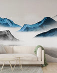 Ink Mountains removable wallpaper with blue and gray misty peaks in modern living room setting