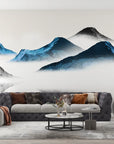 Blue and grey watercolor Ink Mountains mural wallpaper in modern living room with misty peaks