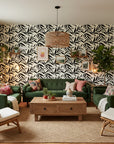 Ink Thicket bold black botanical wallpaper in a warm and inviting living room