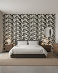 Ink Thicket bold black botanical wallpaper adding character to a cozy bedroom