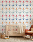 Multicolored geometric Jade Trellis wallpaper with quatrefoil circles in nursery setting