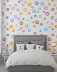 Vibrant multicolored paw print self-adhesive wall covering with a repetitive animal track motif - Joyful Jaunts