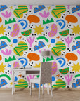 Vibrant multicolored geometric figures on a sleek white adhesive wall covering - Joyful Echoes