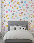 Vibrant multicolored paw print self-adhesive wall covering with a repetitive animal track motif - Joyful Jaunts