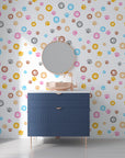 A playful array of rainbow-colored paw prints on a peel-and-stick decorative wall mural - Joyful Jaunts