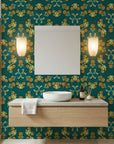 Jungle Saffron bold tropical floral wallpaper in teal and gold as a feature wall in a bright home office