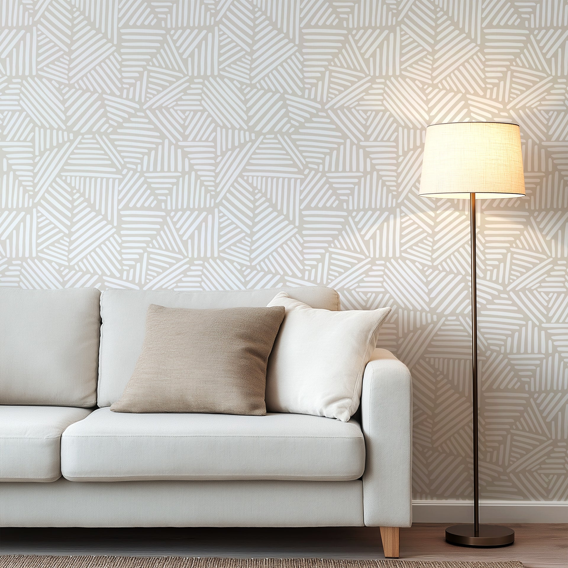 Neutral beige wallpaper with repeating hand drawn geometric blocks made of white linear brush strokes.