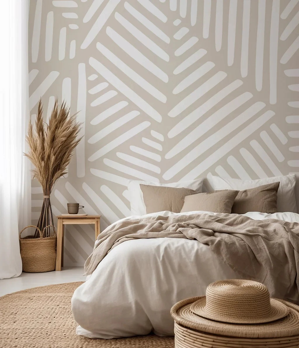 Hand-sketched white linear brush strokes form repeating angular shapes across the neutral beige wallpaper