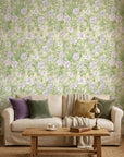 Lavender Garden floral wallpaper with purple blooms and green foliage on cream background in living room setting