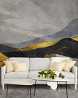 Layered Mountains wallpaper with gold and charcoal peaks on textured gray background in modern living room