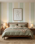 Green and gold Leaf Stripe peel and stick wallpaper on serene bedroom accent wall with natural lighting