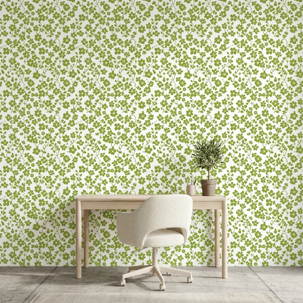 Lime Bloom botanical wallpaper with green clover pattern on cream background in modern home office setting