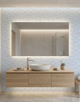 Little Minnows blue nursery fish wallpaper creating ambiance in a serene bathroom