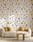 Little Songbirds colorful whimsical bird wallpaper in a warm and inviting living room
