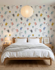Little Songbirds colorful whimsical bird wallpaper adding character to a cozy bedroom