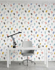 Little Songbirds colorful whimsical bird wallpaper as a feature wall in a bright home office