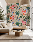 Peach-toned wall covering depicting exotic parrots, palm leaves, and hibiscus blooms. - Lush Notion