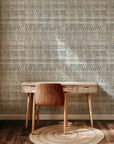Neutral abstract stripe wallpaper with soft vertical brushstroke shapes in muted sage green, warm beige, and light gray tones.