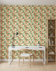 Marigold Orchard warm orange botanical wallpaper as a feature wall in a bright home office