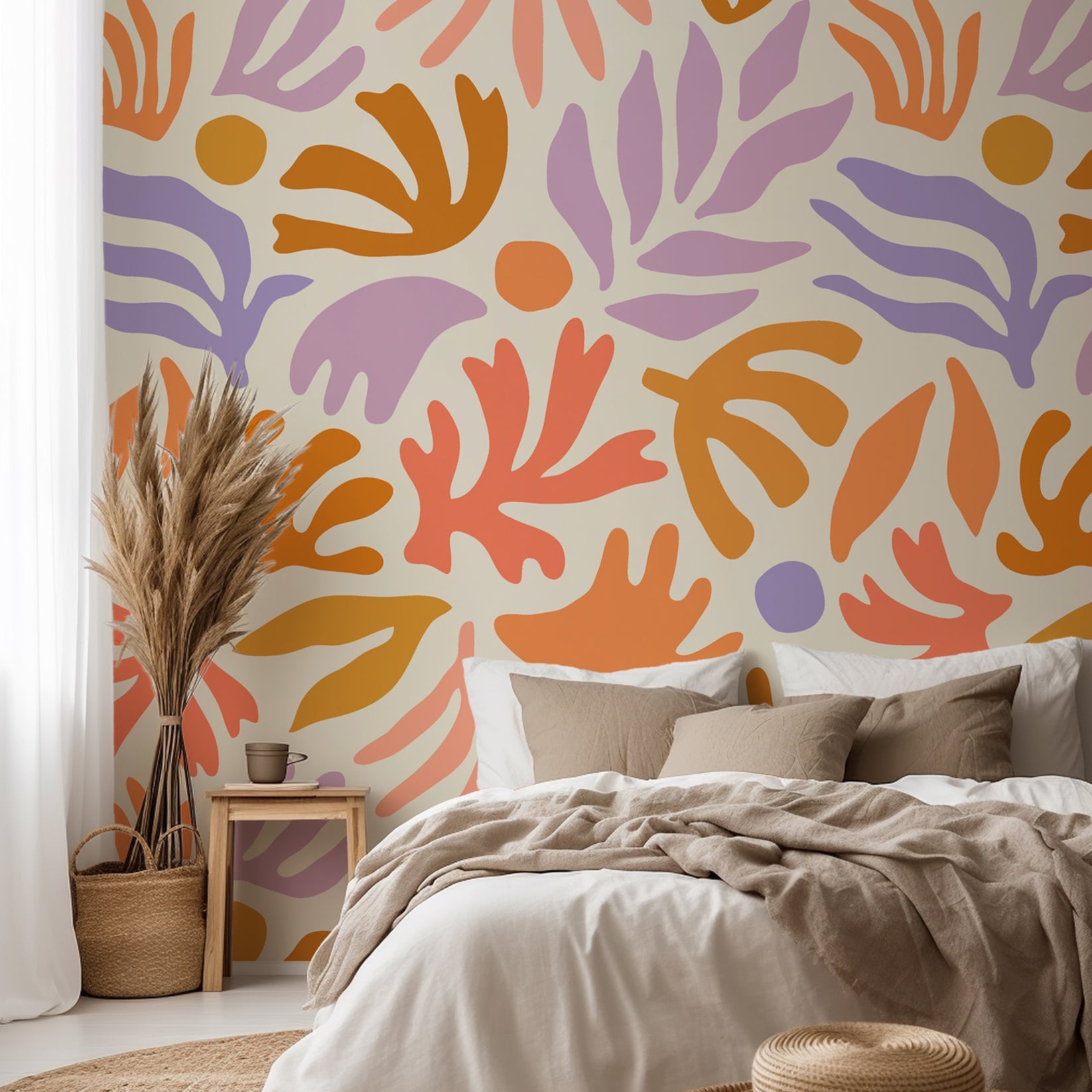 Playful abstract botanical wallpaper with hand painted leaf and floral shapes in peach, lavender, ochre, and soft coral on a warm cream background.