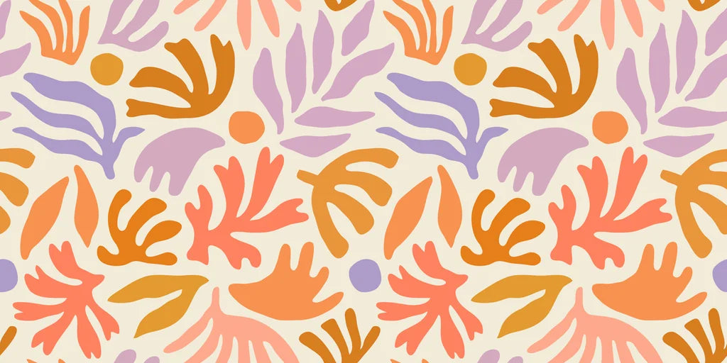 Playful abstract botanical wallpaper with hand painted leaf and floral shapes in peach, lavender, ochre, and soft coral on a warm cream background.
