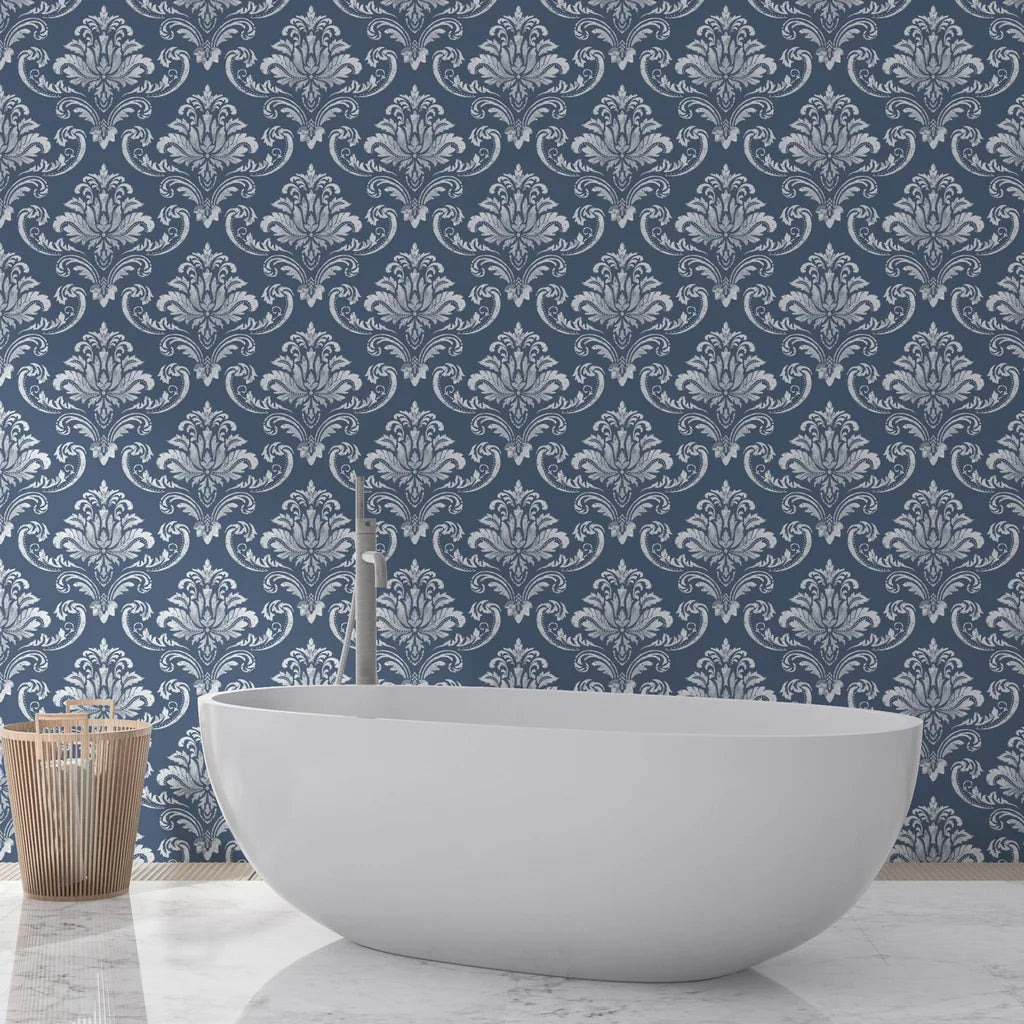 Navy and silver damask Mauve Bloom Essence wallpaper behind white freestanding bathtub in spa bathroom
