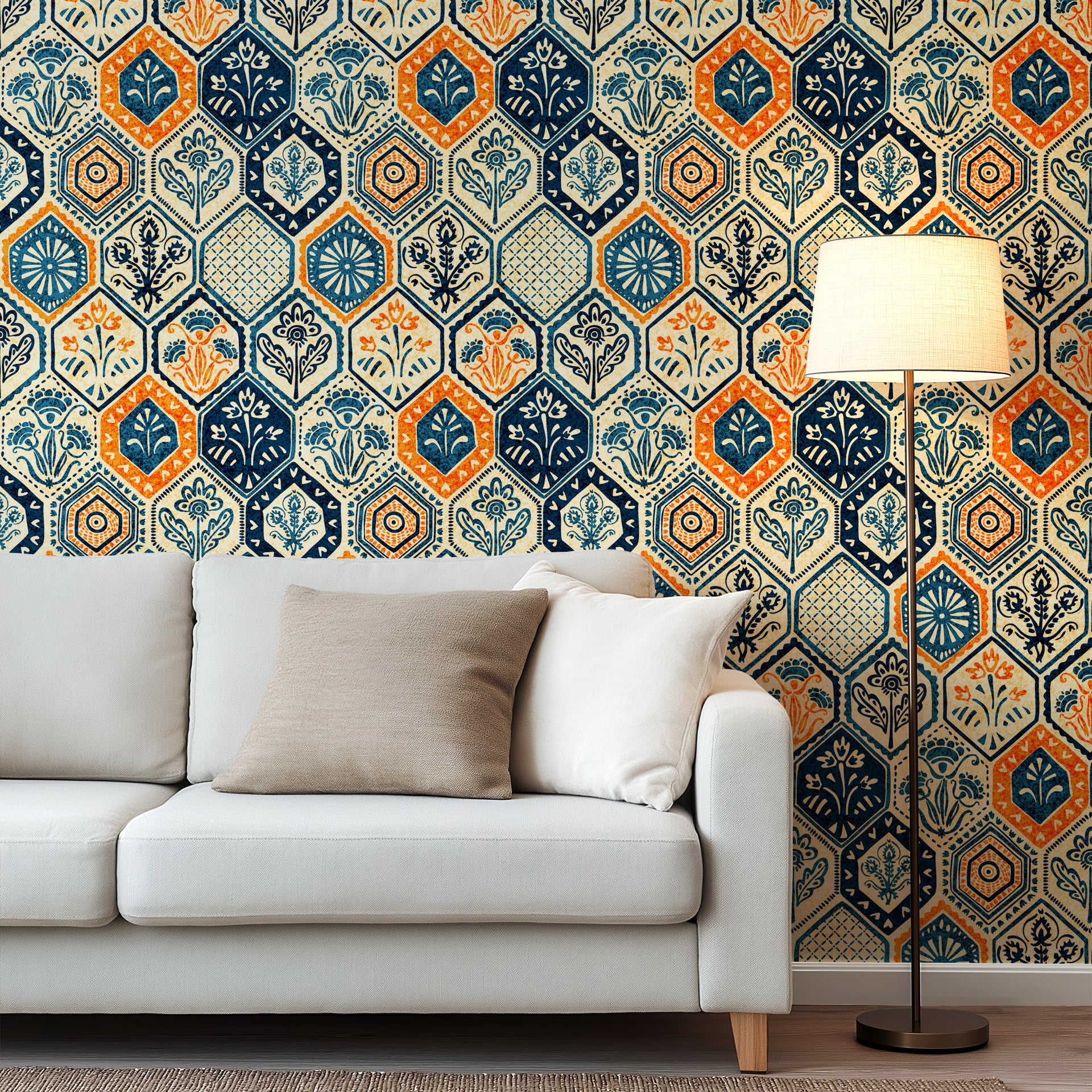Vintage hexagon tile wallpaper with hand printed floral motifs in navy blue, warm orange, and cream tones.