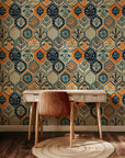 This antique-style wallpaper features a hexagonal tessellation pattern adorned with hand-blocked floral accents in cream, navy, and vibrant orange