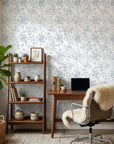 Midnight Bloom Drift removable wallpaper in modern home office with blue-gray floral pattern on cream background