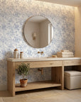 Blue and cream Midnight Bloom Drift peel and stick wallpaper in serene spa bathroom with natural light