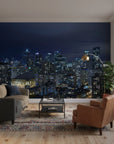 Midnight Constellation city skyline wallpaper mural on living room accent wall with illuminated buildings