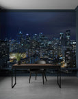 Night cityscape wallpaper mural featuring illuminated skyscrapers in deep blue tones for modern home office