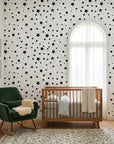 Midnight Dust white with black star pattern wallpaper in a warm and inviting living room