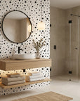 Midnight Dust white with black star pattern wallpaper creating ambiance in a serene bathroom