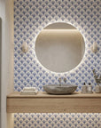 Midnight Garden blue art deco wallpaper creating ambiance in a serene bathroom