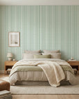 Sage green and cream Mint Morse striped wallpaper with geometric dots on serene bedroom accent wall