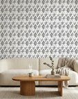 Mist & Stone grey geometric peel and stick wallpaper in a warm and inviting living room