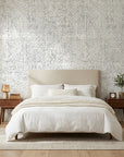 Morning Frost grey abstract weave wallpaper adding character to a cozy bedroom