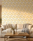 Morning Meadow yellow floral peel and stick wallpaper in a warm and inviting living room