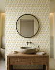 Morning Meadow yellow floral peel and stick wallpaper creating ambiance in a serene bathroom
