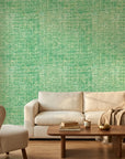 Moss Field green organic texture wallpaper in a warm and inviting living room