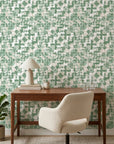 Mossy Ground green abstract peel and stick wallpaper as a feature wall in a bright home office
