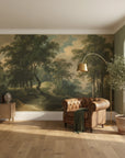 Classical landscape mural wallpaper featuring green forest trees and golden sky in traditional living room setting