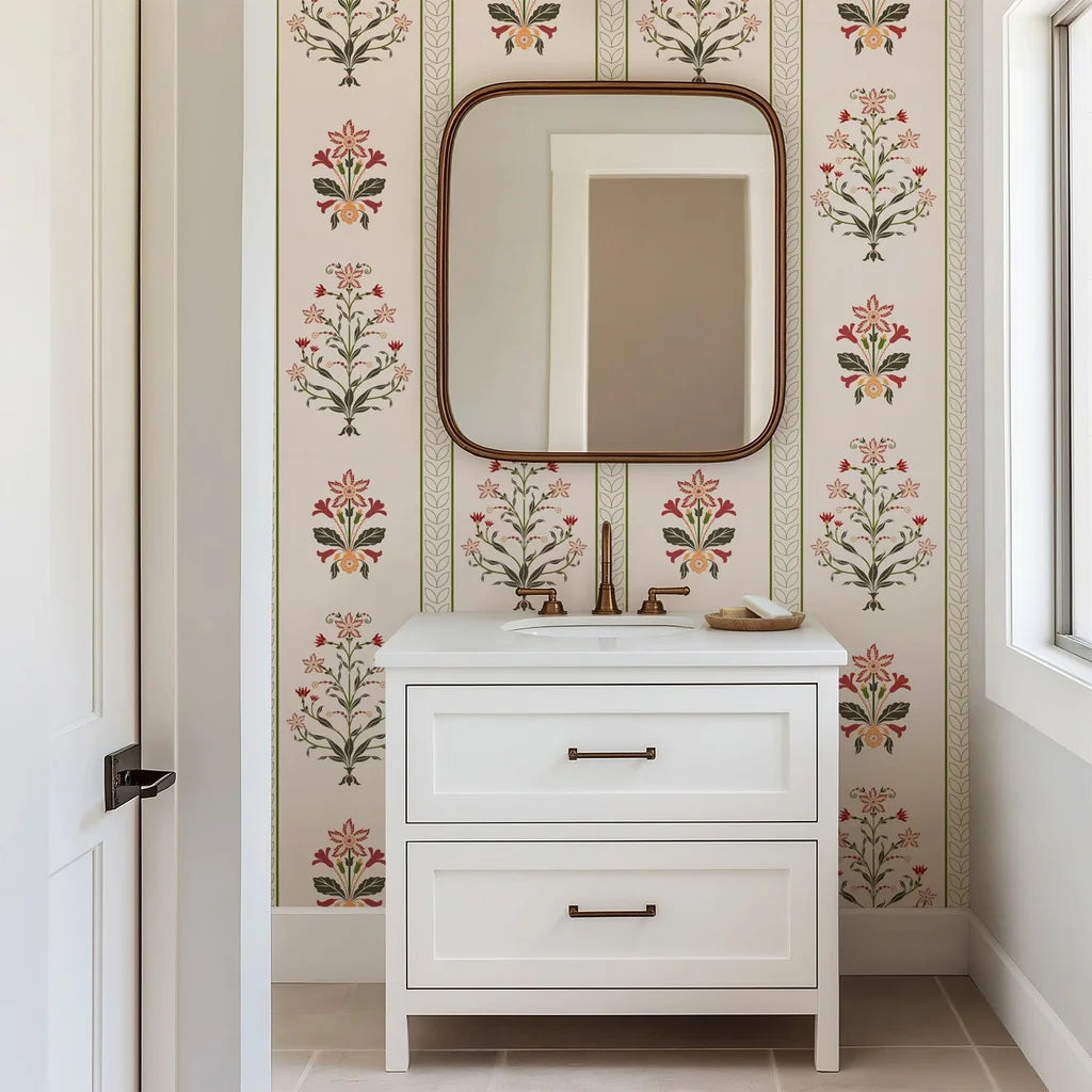 Folk-inspired wallpaper featuring symmetrical blooms arranged in vertical stripes, utilizing red, olive green, and pale peach colors on a warm cream ground