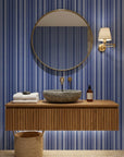 Nautical Code blue and white striped wallpaper creating ambiance in a serene bathroom