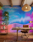 Neon Tide vibrant blue and pink abstract wallpaper adding character to a cozy bedroom