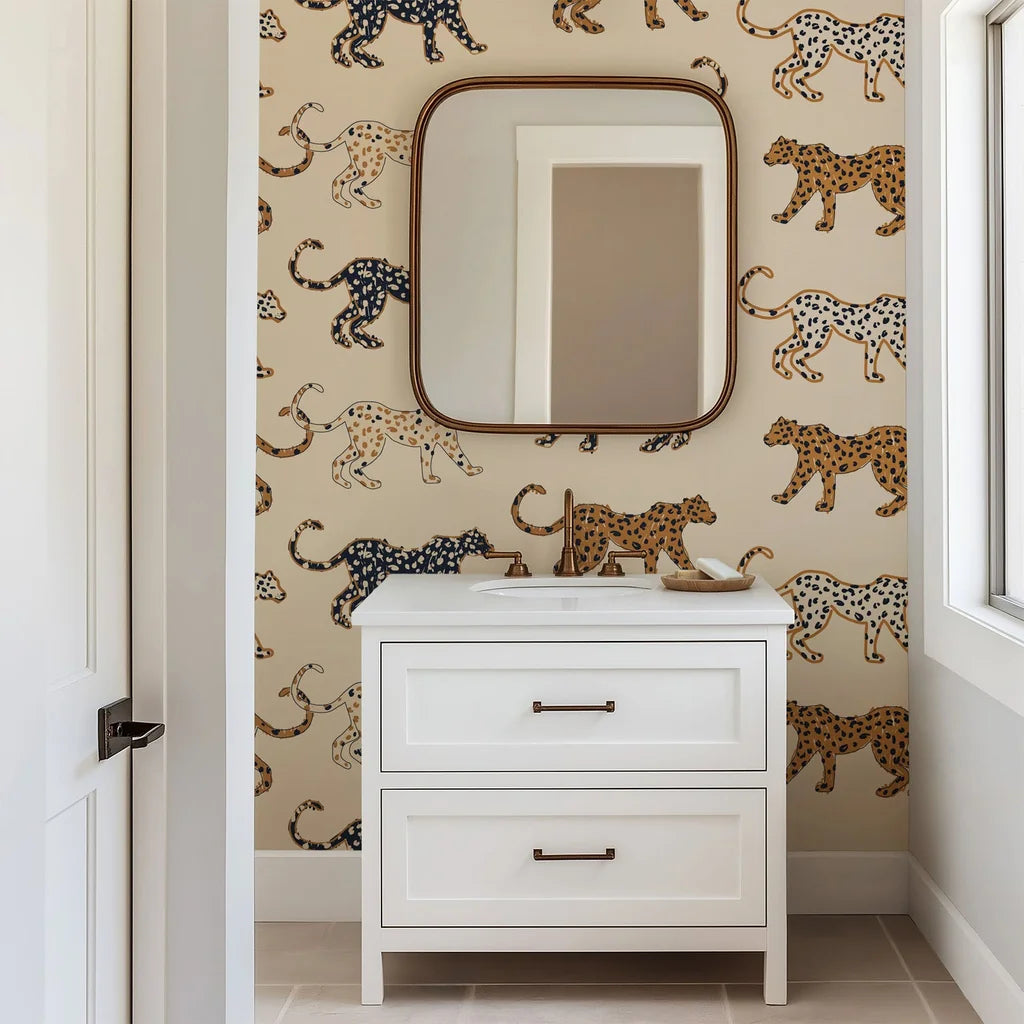 Wallpaper displaying playful, black, tan, and caramel spotted cats. This design is hand-sketched on a soft beige base